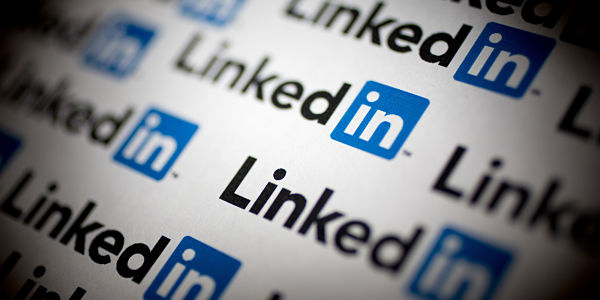 Close-up of multiple LinkedIn logos on a white background.