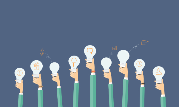 Multiple hands hold lit light bulbs against a blue background, symbolizing teamwork and bright ideas.