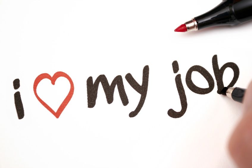 Handwritten phrase 'I love my job' with a red heart symbol, drawn with markers on white paper.