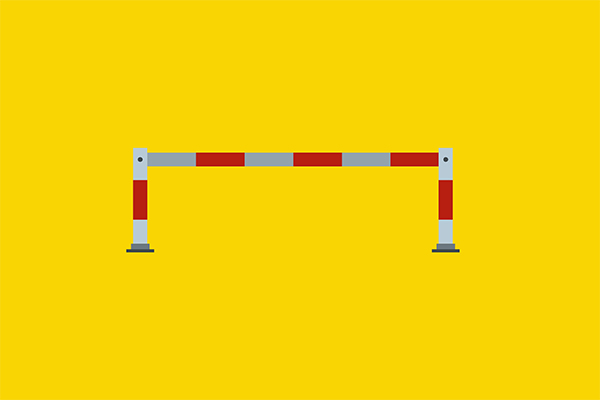 Red-and-gray striped barrier spanning an opening, blocking entry against a solid yellow background with two supporting posts.