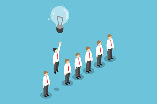 Line of seven businesspeople in white shirts and red ties, one reaching up to a lightbulb balloon representing an idea and teamwork.