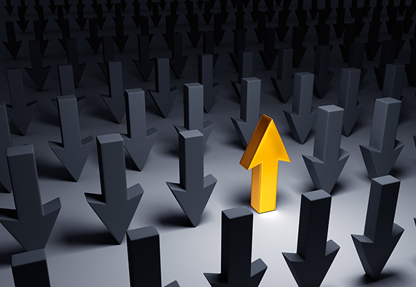 Gold upward arrow rising above a crowd of gray downward arrows, symbolizing leadership or rising performance.