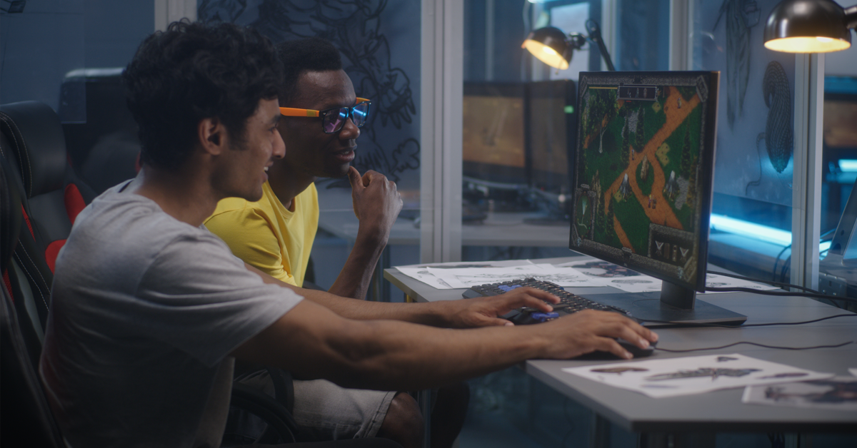 Two people in an office playing a computer game