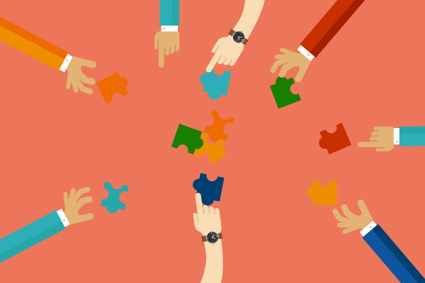 Multiple hands from the edges hold colorful puzzle pieces, coming together in the center to symbolize teamwork.