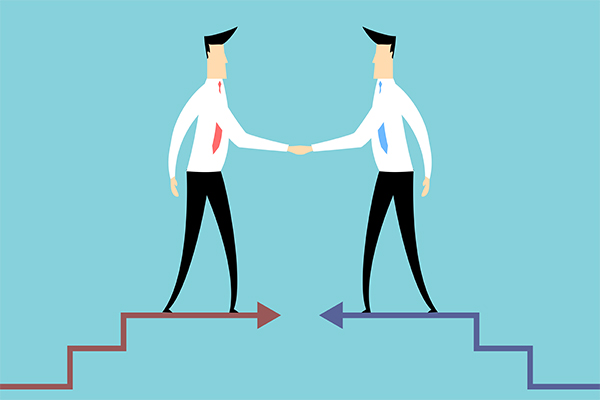 Two suited individuals on stair platforms shake hands, symbolizing an agreement or partnership between opposing paths.